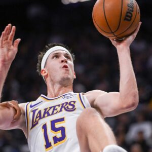 Los Angeles Lakers guard Austin Reaves (15) is fouled on the shot during the second quarter of the game against the Sacramento Kings at Golden 1 Center.