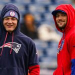 Buffalo Bills quarterback Josh Allen (17) and New England Patriots quarterback Drake Maye (10) talk on the field before the start of the game at Gillette Stadium.
