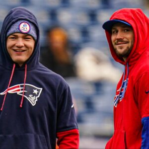 Buffalo Bills quarterback Josh Allen (17) and New England Patriots quarterback Drake Maye (10) talk on the field before the start of the game at Gillette Stadium.