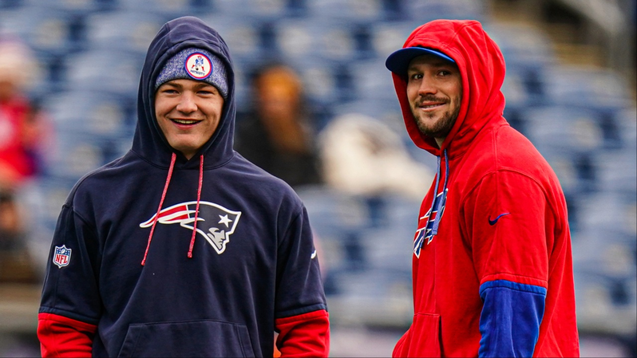 Buffalo Bills quarterback Josh Allen (17) and New England Patriots quarterback Drake Maye (10) talk on the field before the start of the game at Gillette Stadium.
