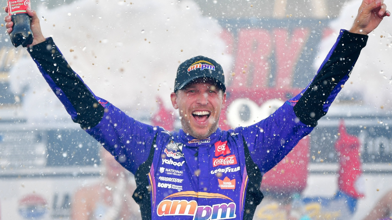 Oct 12, 2025; Las Vegas, Nevada, USA; NASCAR Cup Series driver Denny Hamlin (11) celebrates his victory following the South Point 400 at Las Vegas Motor Speedway. Mandatory Credit: Gary A. Vasquez-Imagn Images