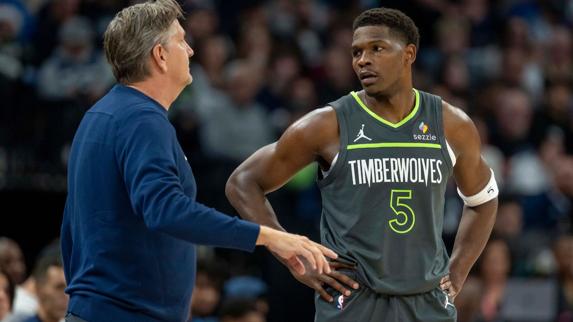 Dec 21, 2024; Minneapolis, Minnesota, USA; Minnesota Timberwolves head coach Chris Finch talks with Minnesota Timberwolves guard Anthony Edwards (5) against the Golden State Warriors in the first half at Target Center.