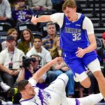Oct 13, 2025; Salt Lake City, Utah, USA; Utah Jazz center Jusuf Nurkić (30) slides for the ball against Dallas Mavericks forward Cooper Flagg (32) during the first quarter at Delta Center.