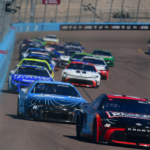 Mar 9, 2025; Avondale, Arizona, USA; NASCAR Cup Series driver Christopher Bell (20) leads driver William Byron (24) and the field for the restart of the Shriners Children’s 500 at Phoenix Raceway. Mandatory Credit: Gary A. Vasquez-Imagn Images