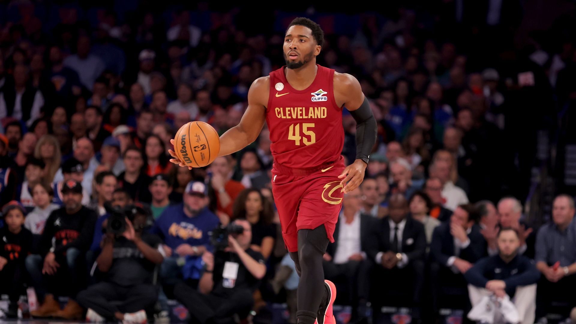 Oct 22, 2025; New York, New York, USA; Cleveland Cavaliers guard Donovan Mitchell (45) brings the ball up court against the New York Knicks during the first quarter at Madison Square Garden.