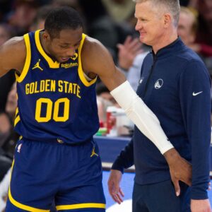 Jan 25, 2024; San Francisco, California, USA; Golden State Warriors forward Jonathan Kuminga (00) reacts after a foul with head coach Steve Kerr against the Sacramento Kings during the second quarter at Chase Center