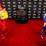 Feb 14, 2024; Daytona Beach, Florida, USA; NASCAR Cup Series driver Joey Logano (22) and driver Kyle Larson (5) speaks with reporters during media day at Daytona International Speedway