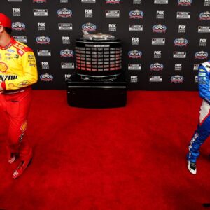 Feb 14, 2024; Daytona Beach, Florida, USA; NASCAR Cup Series driver Joey Logano (22) and driver Kyle Larson (5) speaks with reporters during media day at Daytona International Speedway