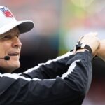 NFL referee Shawn Hochuli (83) acknowledges the crowd during the third quarter of the game between the Cleveland Browns and the Miami Dolphins at Huntington Bank Field.