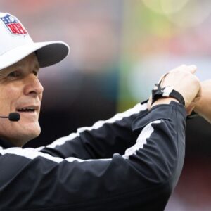 NFL referee Shawn Hochuli (83) acknowledges the crowd during the third quarter of the game between the Cleveland Browns and the Miami Dolphins at Huntington Bank Field.