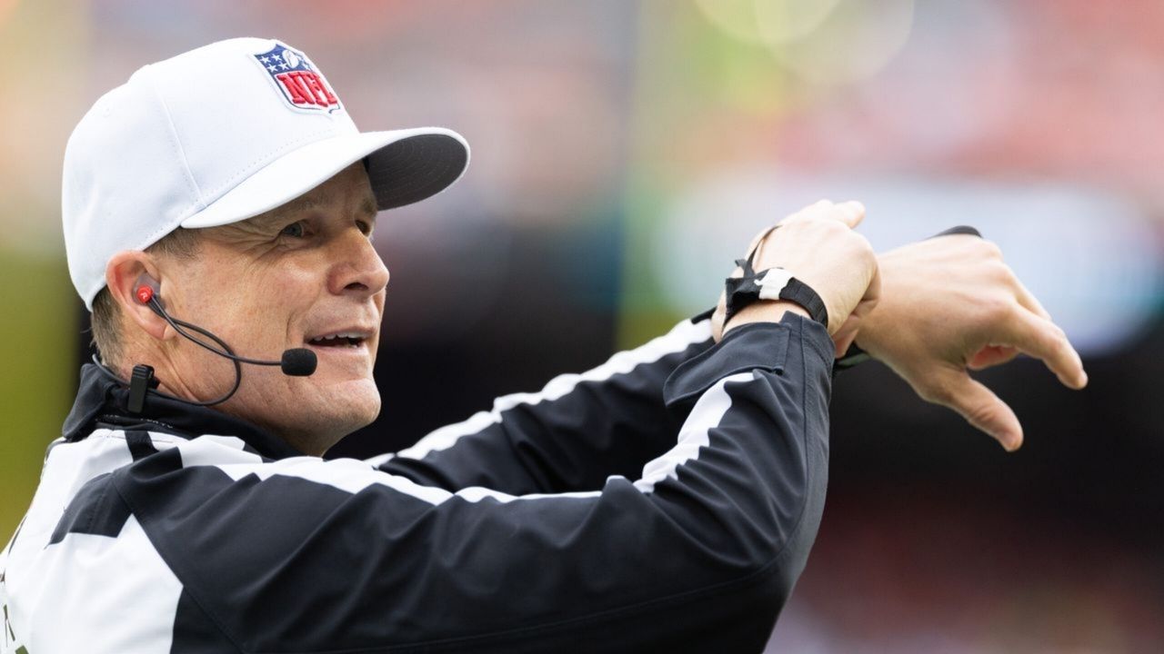 NFL referee Shawn Hochuli (83) acknowledges the crowd during the third quarter of the game between the Cleveland Browns and the Miami Dolphins at Huntington Bank Field.
