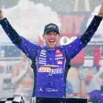 Oct 12, 2025; Las Vegas, Nevada, USA; NASCAR Cup Series driver Denny Hamlin (11) celebrates his victory following the South Point 400 at Las Vegas Motor Speedway