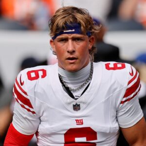 New York Giants quarterback Jaxson Dart (6) looks on during warmups against the Denver Broncos at Empower Field at Mile High.