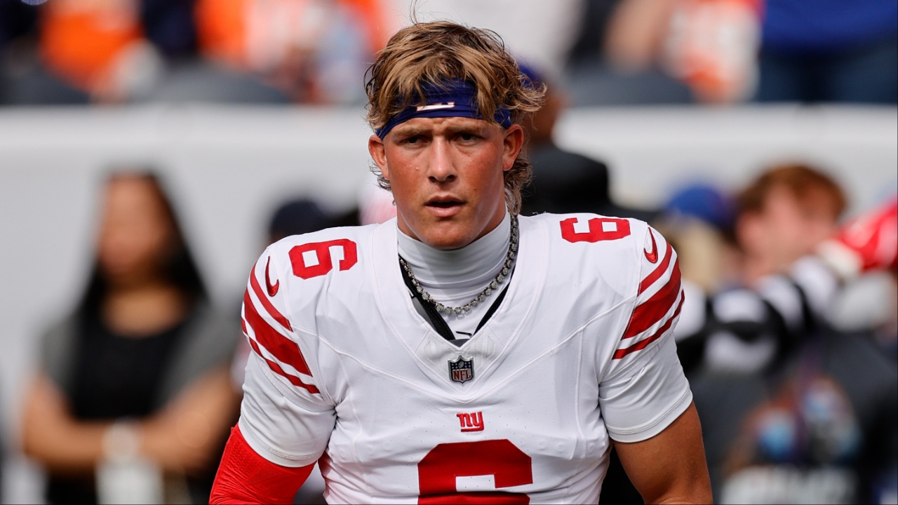 New York Giants quarterback Jaxson Dart (6) looks on during warmups against the Denver Broncos at Empower Field at Mile High.