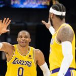 November 30, 2021; Sacramento, California, USA; Los Angeles Lakers guard Russell Westbrook (0) celebrates with forward Carmelo Anthony (7) during the third quarter against the Sacramento Kings at Golden 1 Cente