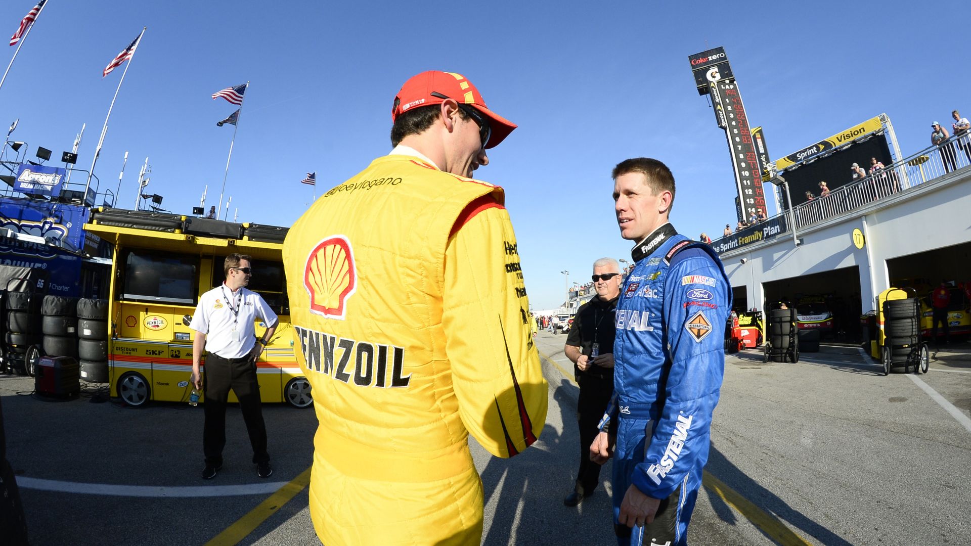 Feb 19, 2014; Daytona Beach, FL, USA; NASCAR Sprint Cup driver Joey Logano (22) talks with NASCAR Sprint Cup driver Dale Earnhardt Jr (88) during practice for the Daytona 500 at Daytona International Speedway.