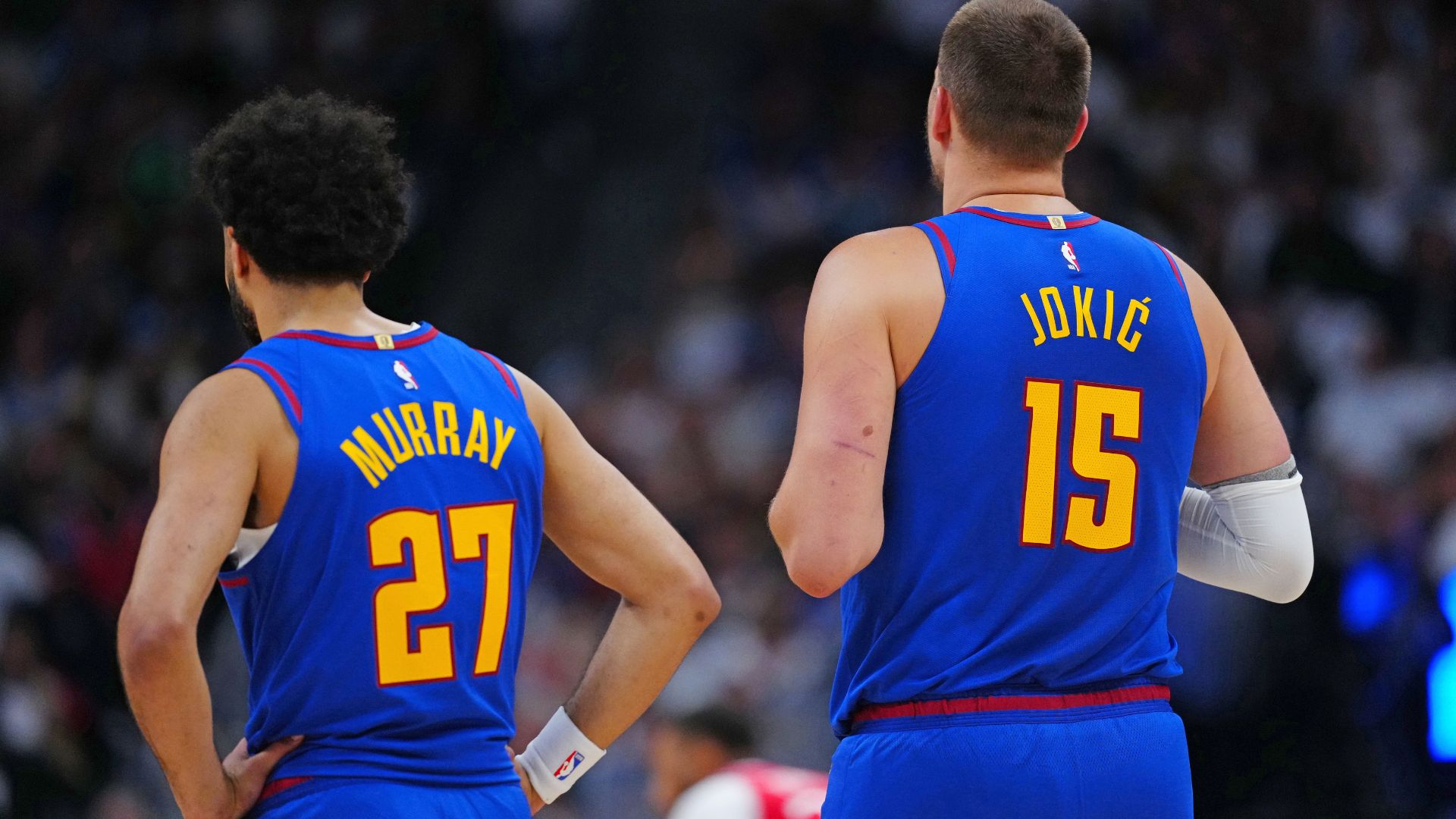 May 3, 2025; Denver, Colorado, USA; Denver Nuggets guard Jamal Murray (27) and Denver Nuggets center Nikola Jokic (15) during the first quarter against the LA Clippers during game seven of first round for the 2025 NBA Playoffs at Ball Arena