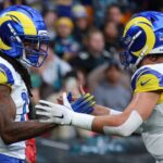 Los Angeles Rams wide receiver Davante Adams (17) celebrates with quarterback Matthew Stafford (9) after scoring a touchdown against the Jacksonville Jaguars during the first half during a NFL International Series game at Wembley Stadium.