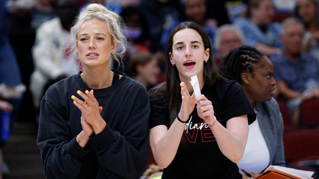 Injured Indiana Fever guard Sophie Cunningham (8) and guard Caitlin Clark (22) react from the bench during the first half of a WNBA game against the Chicago Sky at United Center.