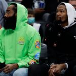 Brooklyn Nets guard James Harden (left) and forward Kevin Durant (right) sit on the bench in the first half against the Detroit Pistons at Little Caesars Arena.
