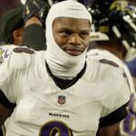 Baltimore Ravens quarterback Lamar Jackson gets ready to take the field during the second half of their game against the Baltimore Ravens at Highmark Stadium in Orchard Park on Sept. 7, 2025.