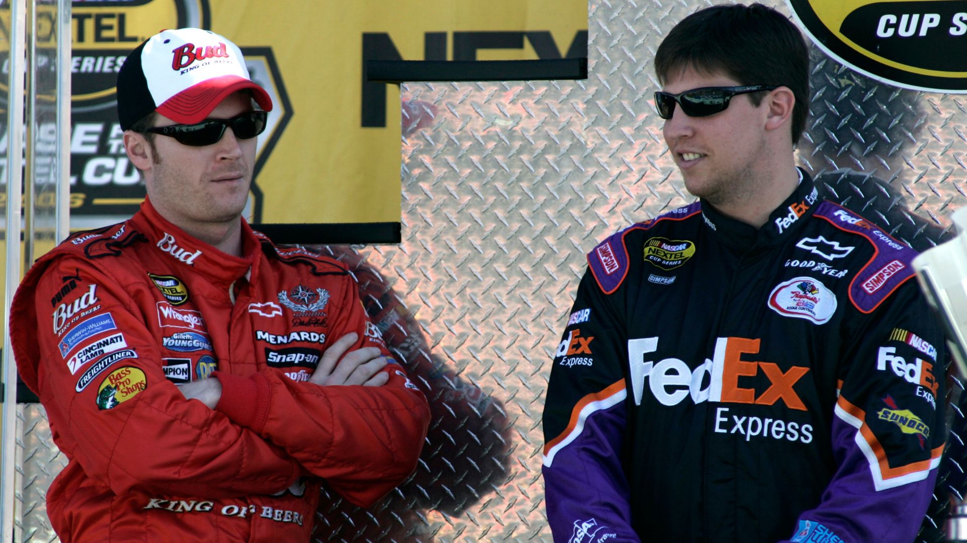 NASCAR Driver Dale Earnhardt Jr., Dale Earnhardt Jrl and Denny Hamlin are introduced during driver introductions prior to the Nextel Cup Ford 400 at Homestead-Miami Speedway in Homestead, Florida
