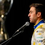 Aug 27, 2025; Charlotte, NC, USA; Chase Elliott answers questions from the media during NASCAR Cup Series Playoff Media Day at Charlotte Convention Center