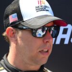 Aug 10, 2025; Watkins Glen, New York, USA; NASCAR Cup Series driver Brad Keselowski (6) looks on prior to the Go Bowling at The Glen at Watkins Glen International.