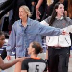 Indiana Fever guard Sophie Cunningham (8) and Indiana Fever guard Caitlin Clark (22) react from the bench to an official’s call Friday, Sept. 26, 2025, during Game 3 of the WNBA semifinals against the Las Vegas Aces at Gainbridge Fieldhouse in Indianapolis.