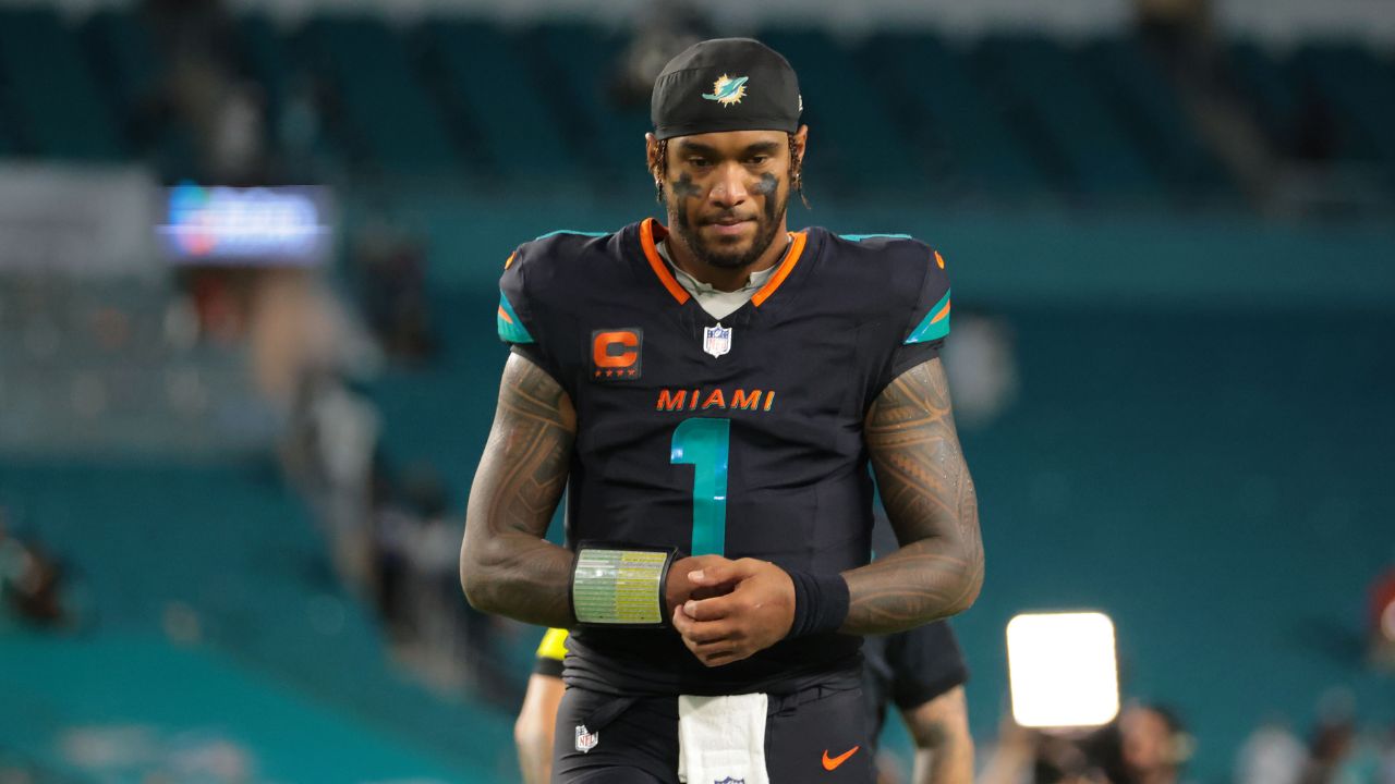 Miami Dolphins quarterback Tua Tagovailoa (1) walks off the field after the game against the New York Jets at Hard Rock Stadium.