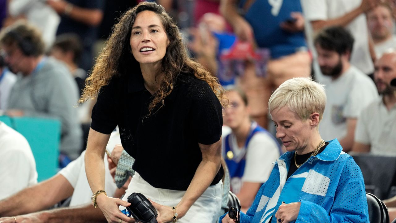 Sue Bird and Megan Rapinoe look on before the game between France and Germany in a men's basketball semifinal game during the Paris 2024 Olympic Summer Games at Accor Arena.