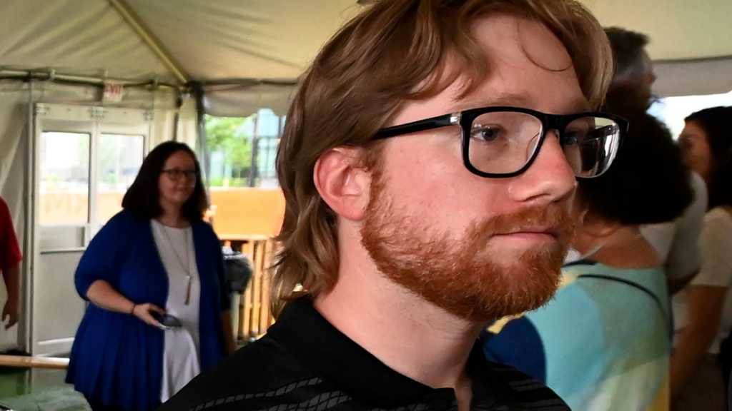 Driver Tyler Reddick stands by his No. 45 Toyota Camry XSE during a partnership announcement at The Pinnacle at Nashville Yards Tuesday, May 20, 2025, in Nashville, Tenn. Pinnacle Financial Partners and 23XI Racing will be involved in the NASCAR Cup Series race at Nashville Super Speedway on June 1.