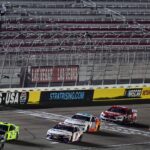 Sep 27, 2020; Las Vegas, Nevada, USA; NASCAR Cup Series driver Kurt Busch (1) leads driver Matt DiBenedetto (21) and driver Denny Hamlin (11) to win the South Point 400 at Las Vegas Motor Speedway