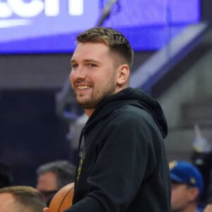 Luka Los Angeles Lakers forward/guard Luka Doncic (77) smiles from the sidelines during the second quarter against the Golden State Warriors at Chase Center.