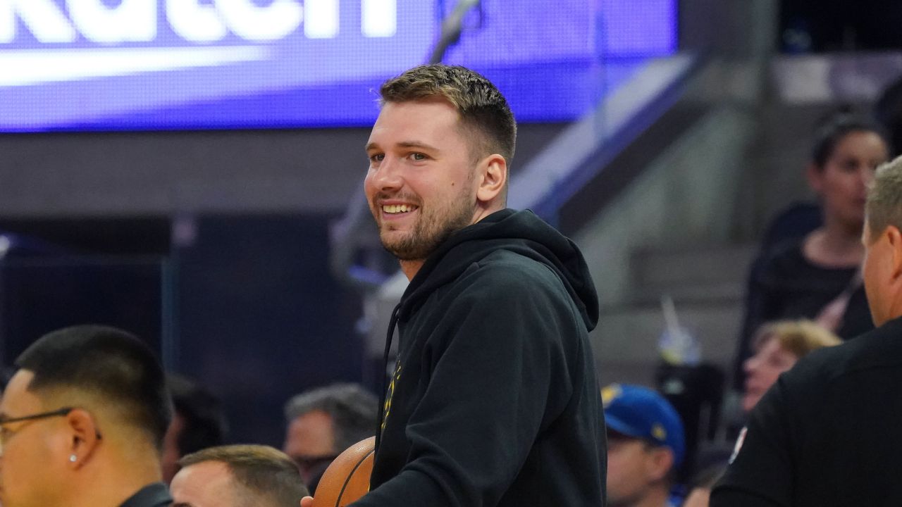 Luka Los Angeles Lakers forward/guard Luka Doncic (77) smiles from the sidelines during the second quarter against the Golden State Warriors at Chase Center.