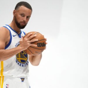 Golden State Warriors guard Stephen Curry (30) holds onto the ball during Media Day at the Chase Center.