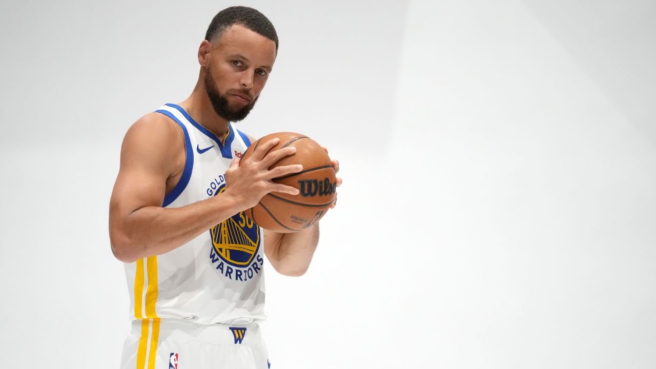 Golden State Warriors guard Stephen Curry (30) holds onto the ball during Media Day at the Chase Center.