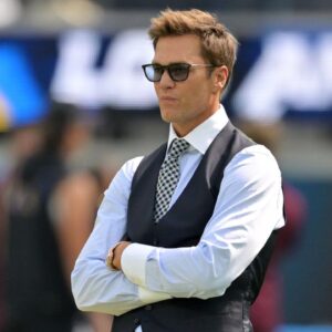 Tom Brady looks on before the game between the Los Angeles Chargers and the Washington Commanders at SoFi Stadium.