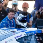 Nov 2, 2025; Avondale, Arizona, USA; NASCAR Cup Series driver Denny Hamlin (11) reacts after climnbing out of his car following the NASCAR Championship race at Phoenix Raceway.