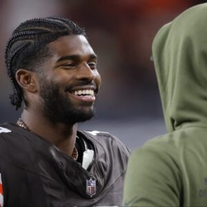 Cleveland Browns quarterback Shedeur Sanders (12) is all smiles as he chats on the sideline during the second half of an NFL football game at Huntington Bank Field, Nov. 16, 2025, in Cleveland, Ohio.