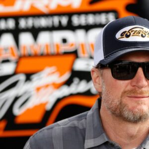 DAYTONA BEACH, FL - FEBRUARY 14: Dale Earnhardt Jr. watches the action from the garage prior to practice for the NASCAR, Motorsport, USA Xfinity Series United Rentals 300 on February 14, 2025 at Daytona International Speedway in Daytona Beach, FL.