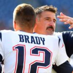 New England Patriots quarterback Tom Brady (12) hugs Tennessee Titans head coach Mike Vrabel before the preseason game at Nissan Stadium.