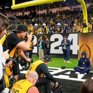Michigan quarterback J.J. McCarthy meditates before the College Football Playoff national championship game against Washington at NRG Stadium in Houston, Texas on Monday, January 8, 2024.