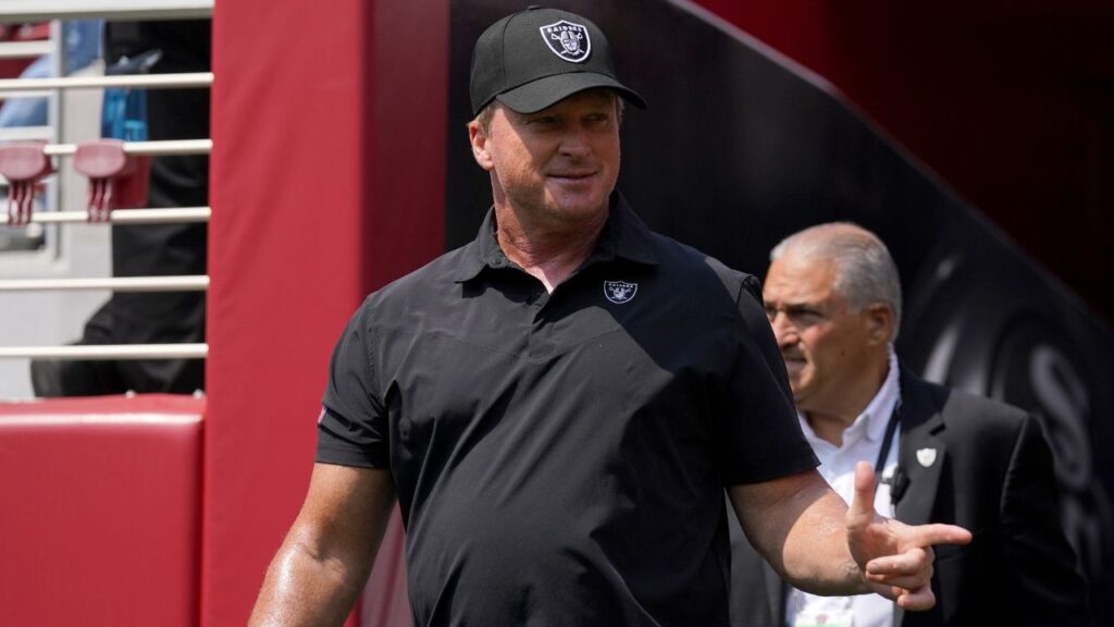 Las Vegas Raiders head coach Jon Gruden walks onto the field before the start of the game against the San Francisco 49ers at Levi's Stadium.