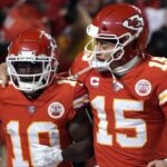 Kansas City Chiefs wide receiver Tyreek Hill (10) celebrates his touchdown with quarterback Patrick Mahomes (15) against the Buffalo Bills during the second half of the AFC Divisional playoff football game at GEHA Field at Arrowhead Stadium.