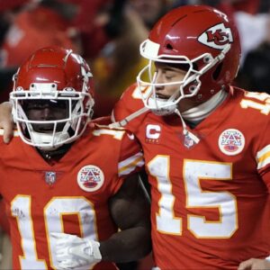 Kansas City Chiefs wide receiver Tyreek Hill (10) celebrates his touchdown with quarterback Patrick Mahomes (15) against the Buffalo Bills during the second half of the AFC Divisional playoff football game at GEHA Field at Arrowhead Stadium.