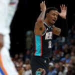 Nov 9, 2025; Memphis, Tennessee, USA; Memphis Grizzlies guard Ja Morant (12) reacts during the fourth quarter against the Oklahoma City Thunder at FedExForum. Mandatory Credit: Petre Thomas-Imagn Images