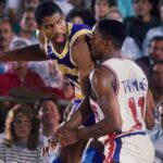 Detroit, MI, USA; FILE PHOTO; Los Angeles Lakers guard Magic Johnson (32) is defended by Detroit Pistons guard Isiah Thomas (11) at the Silverdome.