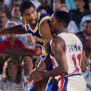 Detroit, MI, USA; FILE PHOTO; Los Angeles Lakers guard Magic Johnson (32) is defended by Detroit Pistons guard Isiah Thomas (11) at the Silverdome.
