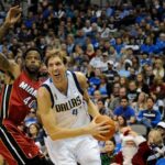 Dallas Mavericks power forward Dirk Nowitzki (41) drives past Miami Heat power forward Udonis Haslem (40) during the second quarter at the American Airlines Center.
